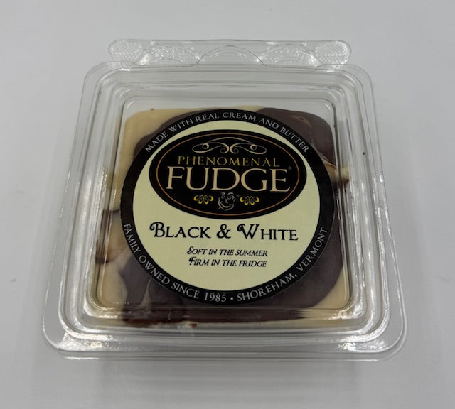 Packaged black and white fudge with 'Phenomenal Fudge' label on a white background