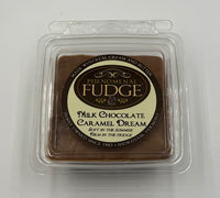 Milk chocolate fudge in a clear plastic packaging with 'Phenomenal Fudge' branding on a white background.