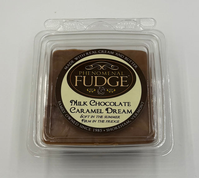 Milk chocolate fudge in a clear plastic packaging with 'Phenomenal Fudge' branding on a white background.
