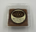 Packaged milk chocolate caramel fudge with peanuts on a white background