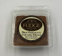 Packaged milk chocolate caramel fudge with peanuts on a white background