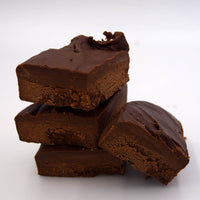 Stack of  dark chocolate fudge on a white background
