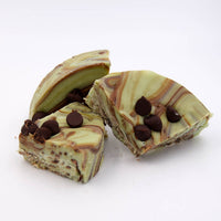 Fudge with swirls of chocolate and vanilla mint with chocolate chips on a white background